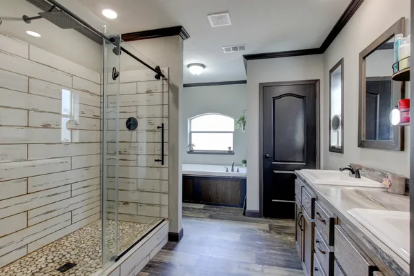a bathroom with a shower and a sink