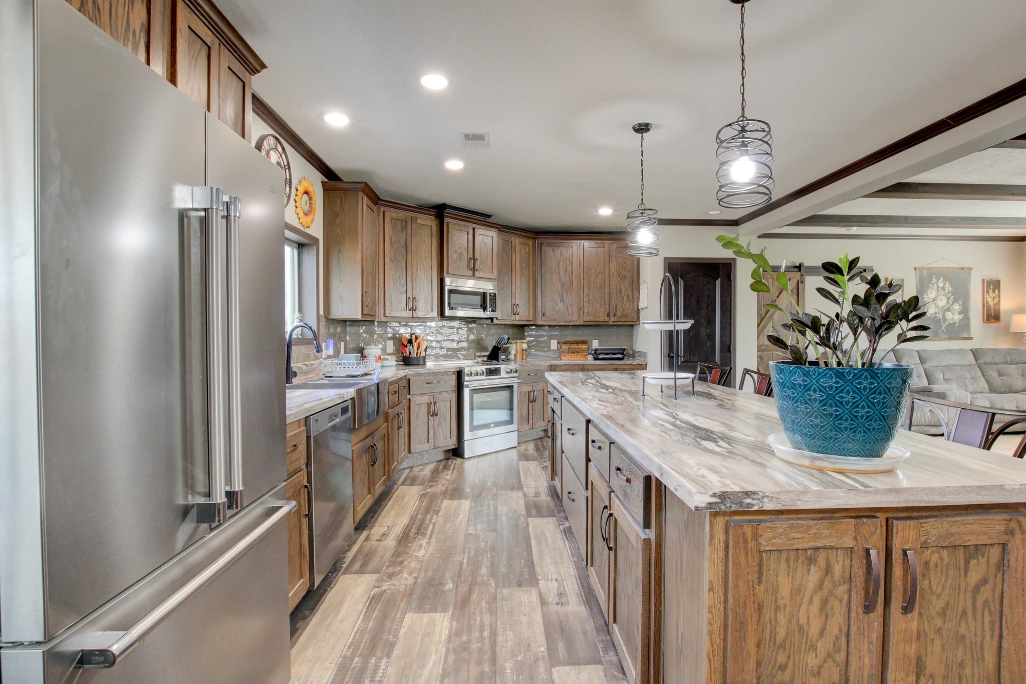 212 Skyline Ridge Dover, TN 37058 - Photo 17 of 41 a kitchen with kitchen island granite countertop a sink a counter space appliances and cabinets