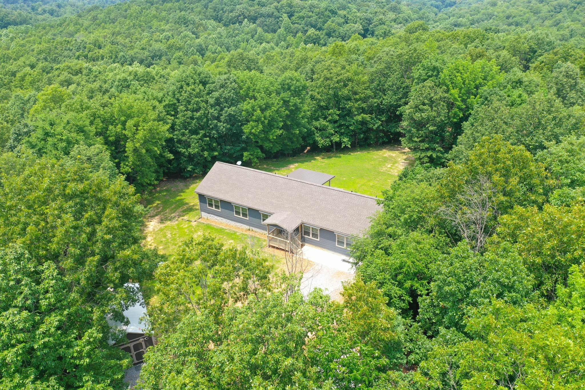 212 Skyline Ridge Dover, TN 37058 - Photo 19 of 41 an aerial view of a house with a yard and lake view