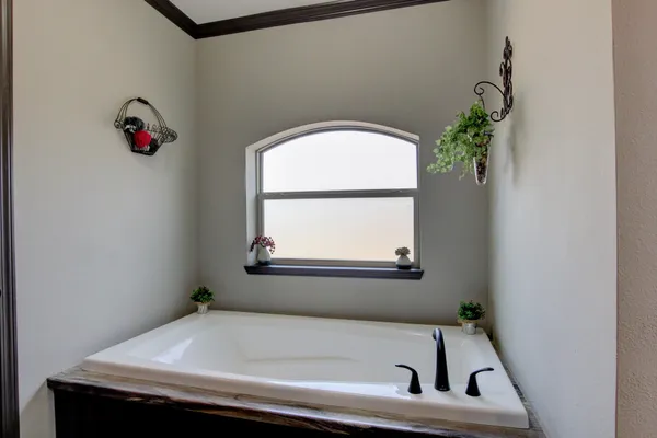 a bathroom with a sink and a window