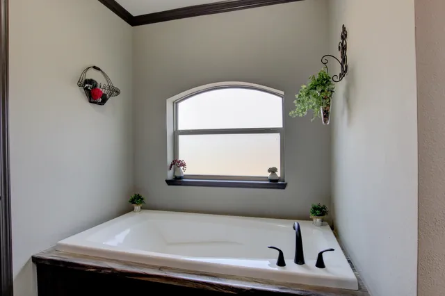 a bathroom with a sink and a window