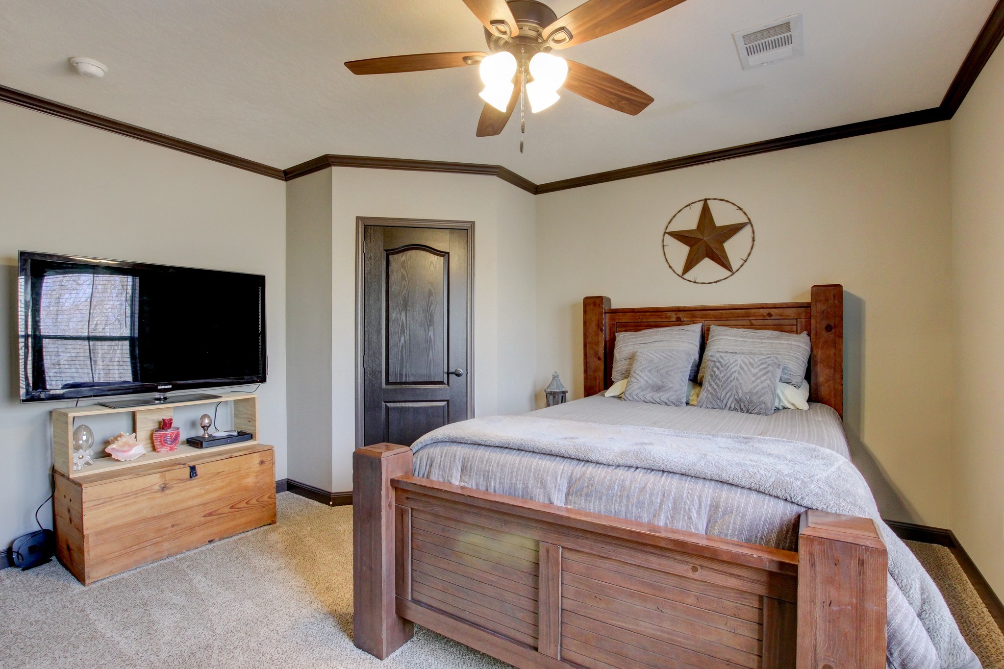 212 Skyline Ridge Dover, TN 37058 - Photo 27 of 41 a bedroom with a bed and a flat screen tv