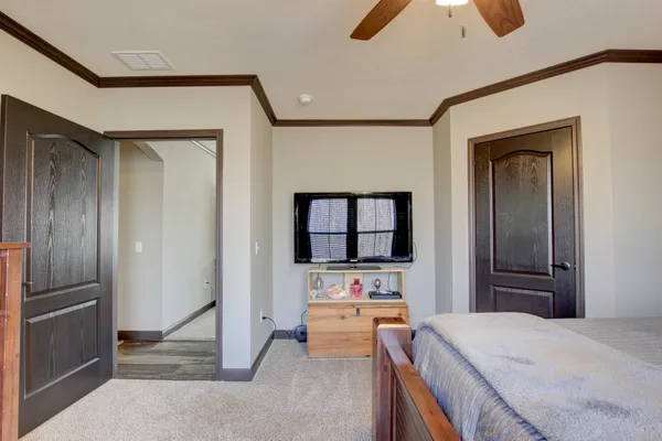 a room with a bed and a view of bathroom