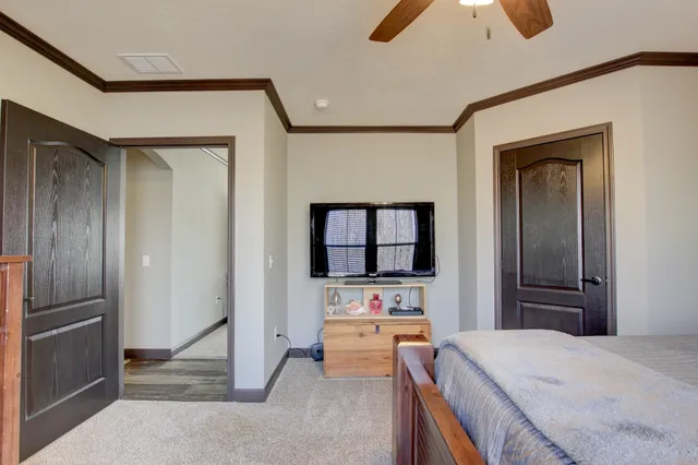 a room with a bed and a view of bathroom