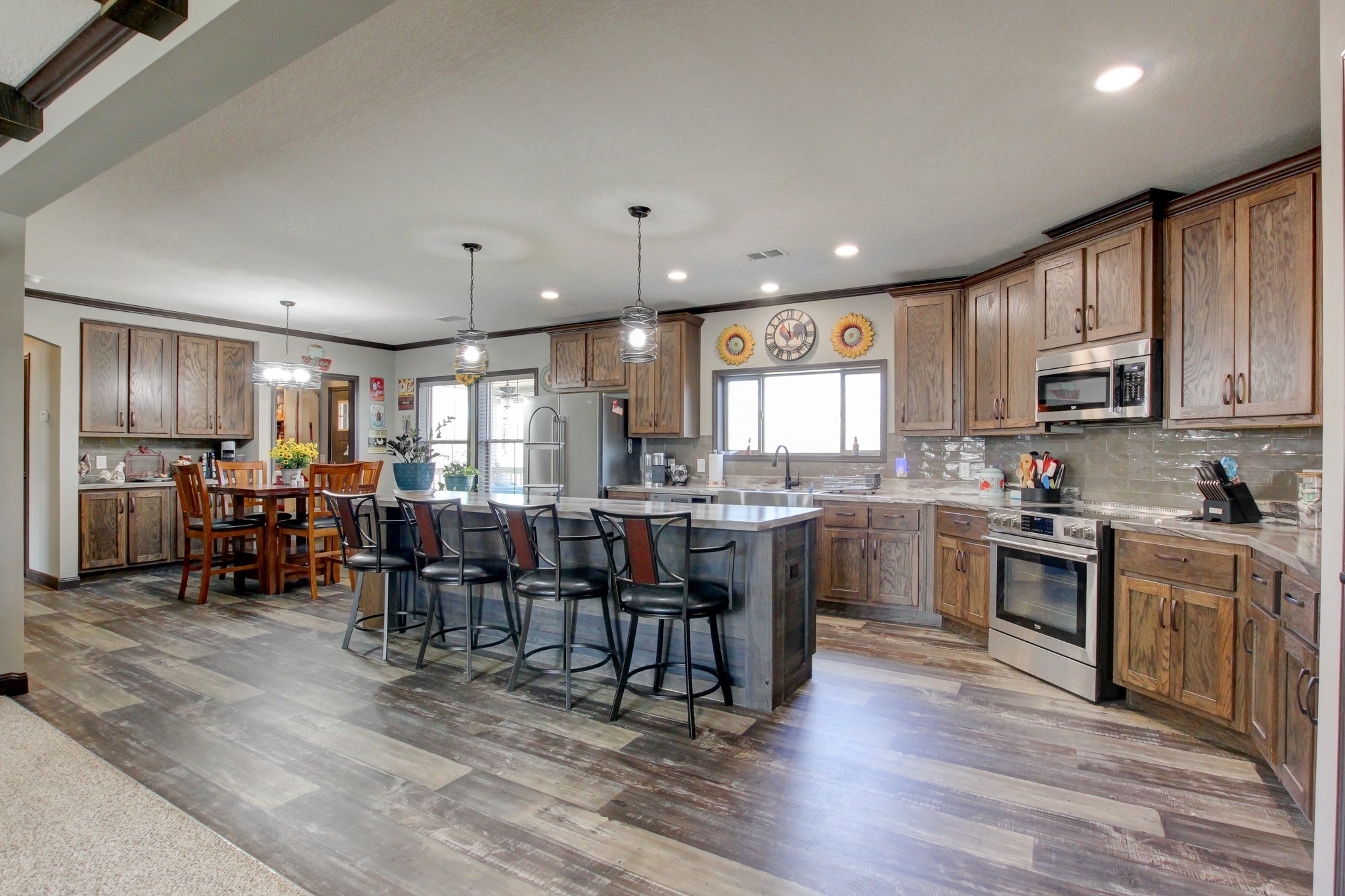212 Skyline Ridge Dover, TN 37058 - Photo 3 of 41 a kitchen with lots of wooden furniture appliances and cabinets