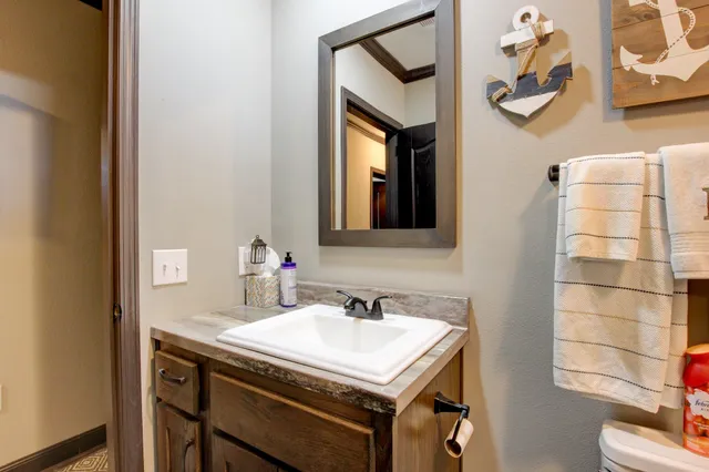 a bathroom with a sink and a mirror