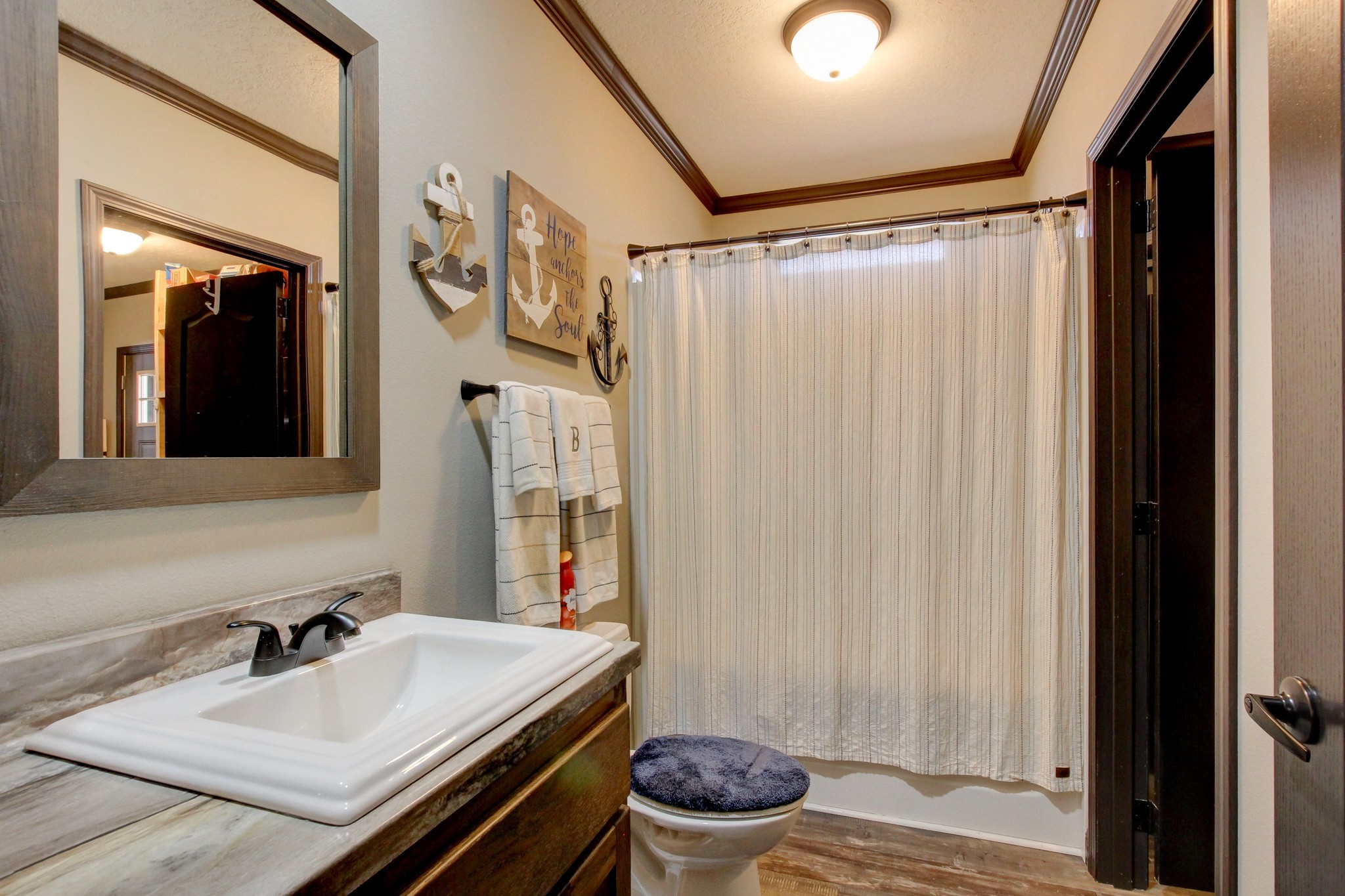 212 Skyline Ridge Dover, TN 37058 - Photo 31 of 41 a bathroom with a sink and a mirror