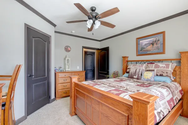 a bedroom with a bed and a dresser