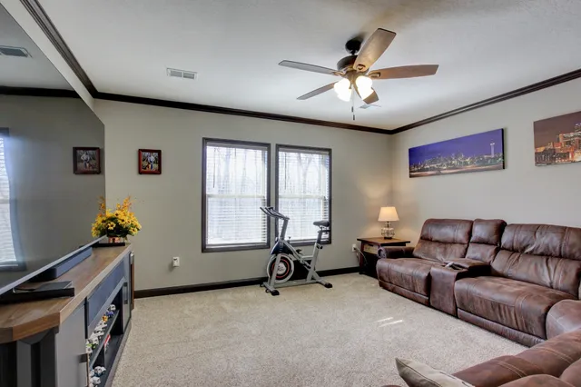 a living room with furniture and a window