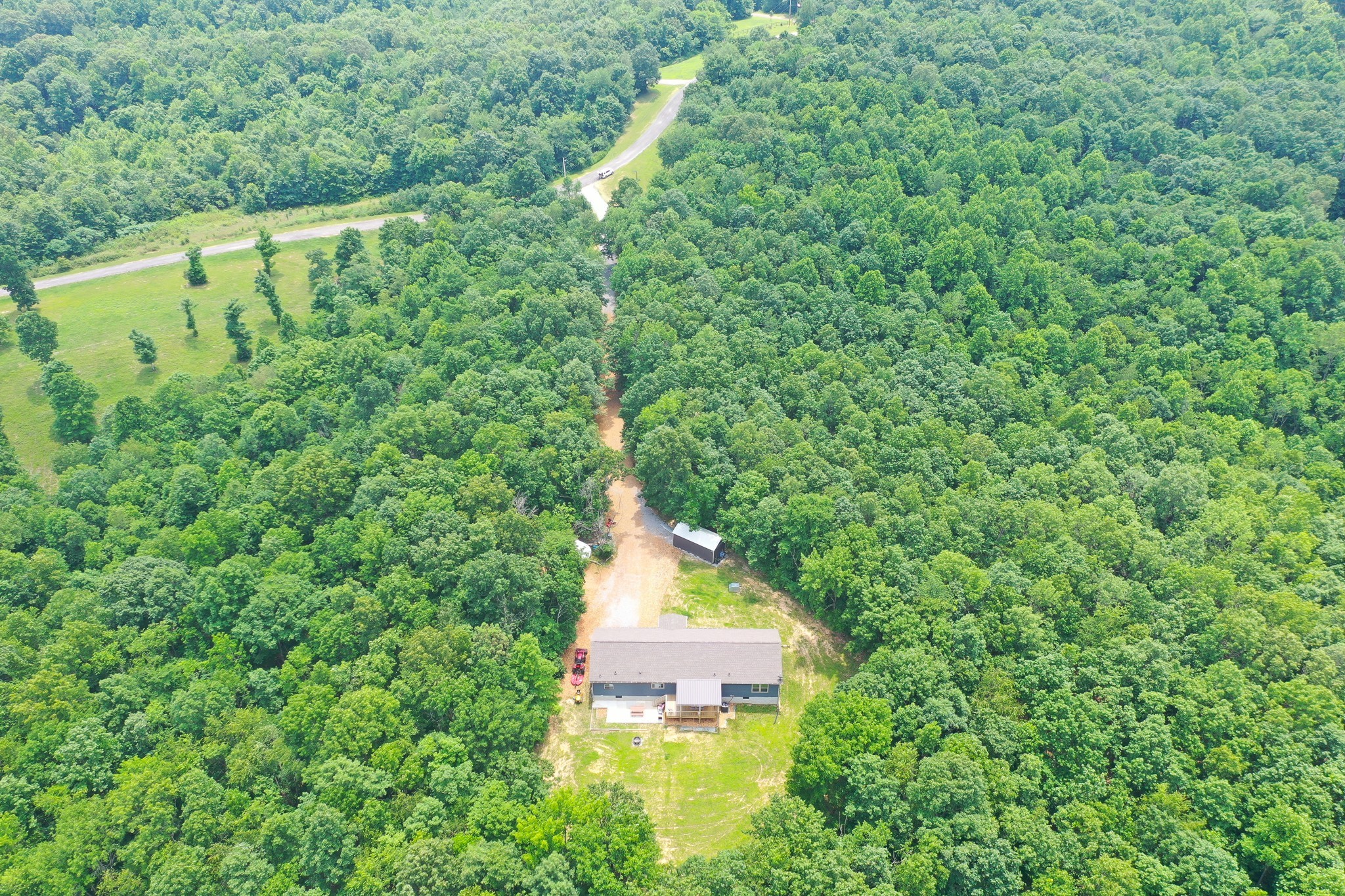 212 Skyline Ridge Dover, TN 37058 - Photo 40 of 41 a view of a large yard with large trees and plants