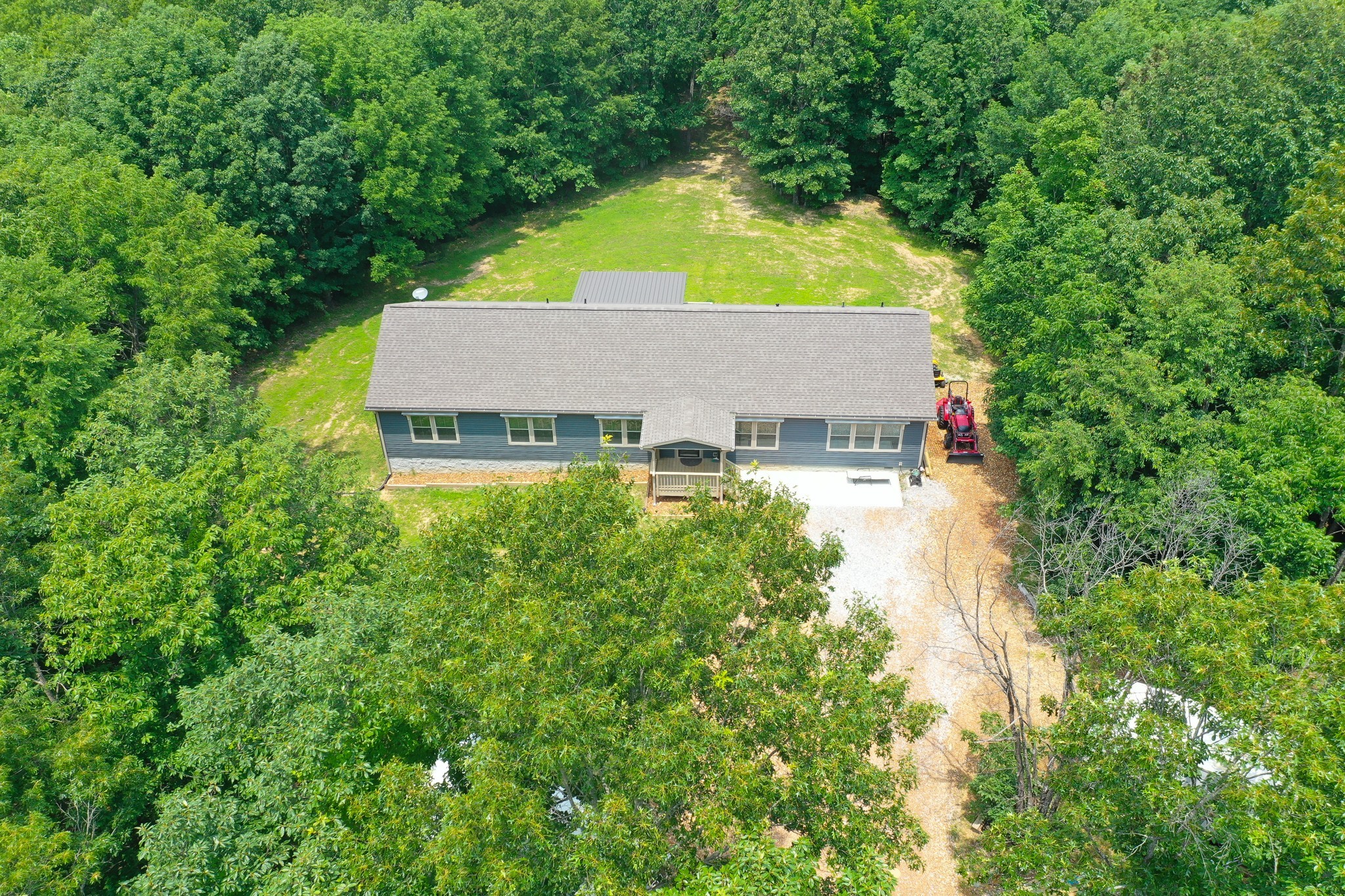 212 Skyline Ridge Dover, TN 37058 - Photo 10 of 41 an aerial view of a house with swimming pool and large trees