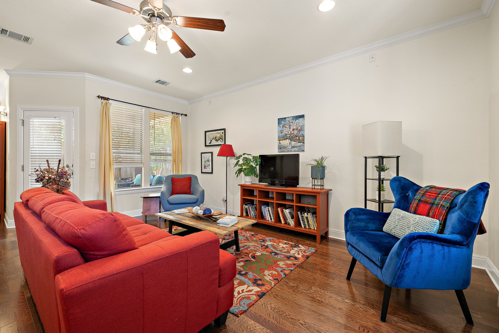 6708 Menchaca Road, Unit 10 Austin, TX 78745 - Photo 4 of 28 Living area featuring recessed lighting, a ceiling fan with light kit, crown molding, and wood-finish flooring