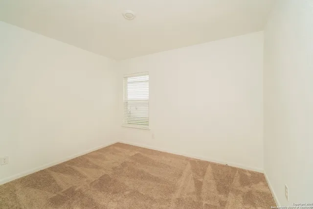 a view of a room that has a window in it