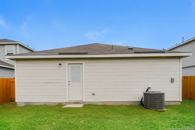 a backyard of a house with lots of green space