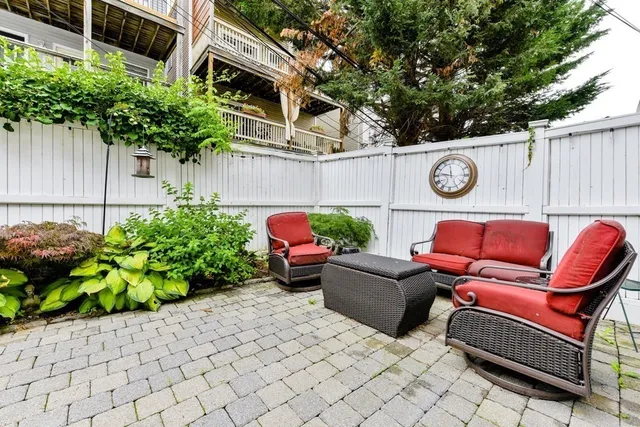 a outdoor living space with furniture and garden view