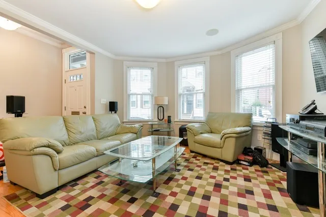 a living room with furniture and windows