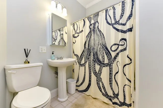 a bathroom with a toilet and a sink