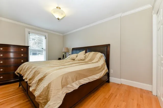 a bedroom with a bed and lamp