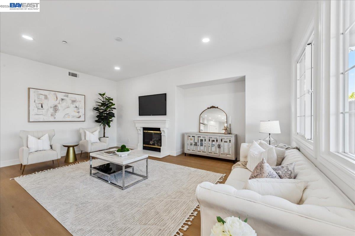 2890 Sable Oaks Way Dublin, CA 94568 - Photo 11 of 60 a living room with furniture a fireplace and a flat screen tv
