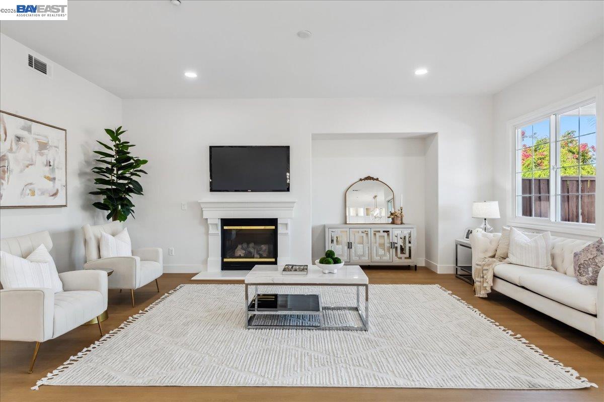 2890 Sable Oaks Way Dublin, CA 94568 - Photo 13 of 60 a living room with furniture a fireplace and a flat screen tv