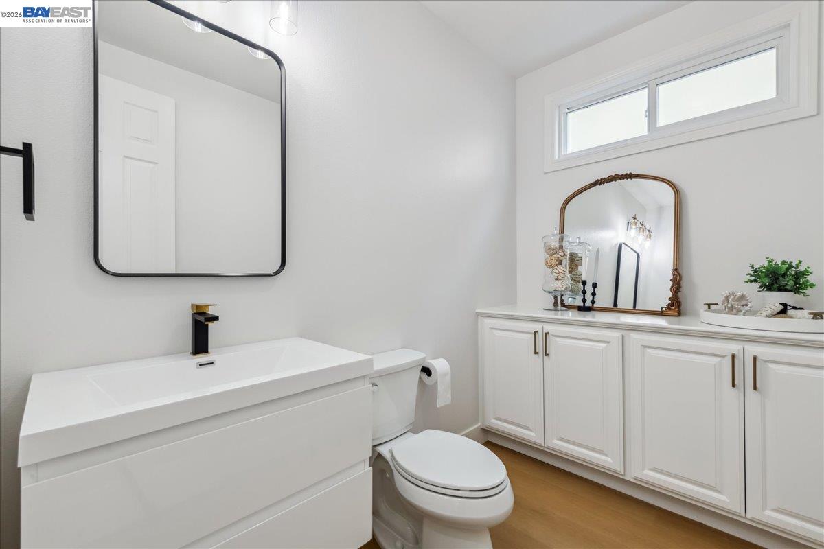 2890 Sable Oaks Way Dublin, CA 94568 - Photo 18 of 60 a bathroom with a toilet sink and mirror