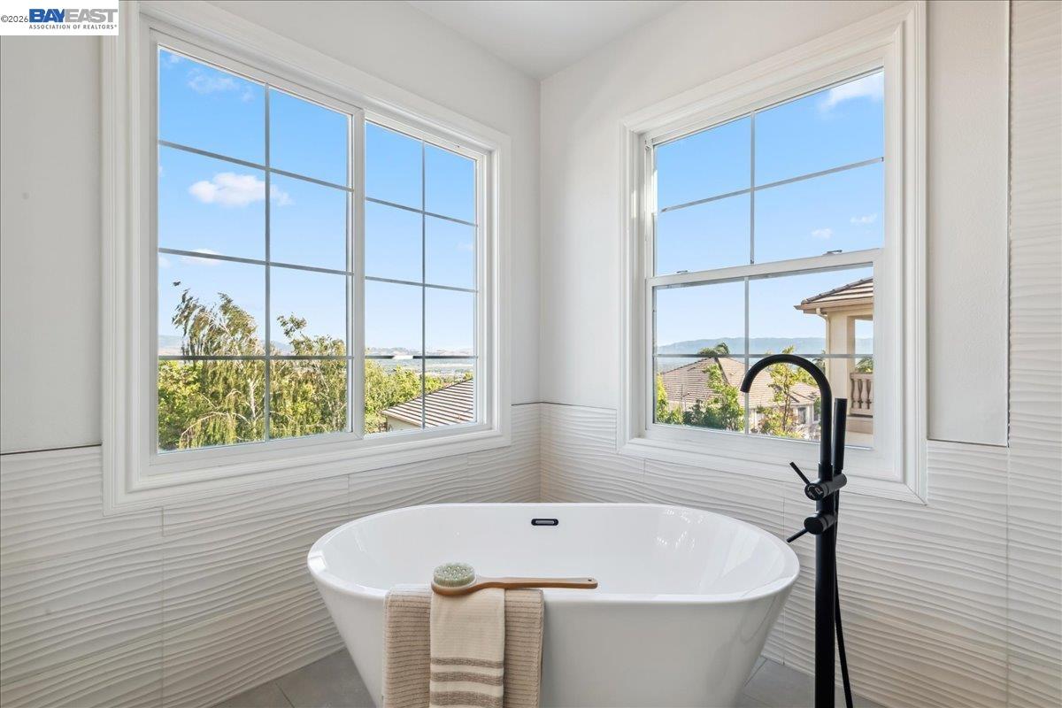 2890 Sable Oaks Way Dublin, CA 94568 - Photo 30 of 60 a bath tub sitting in a bathroom next to a window