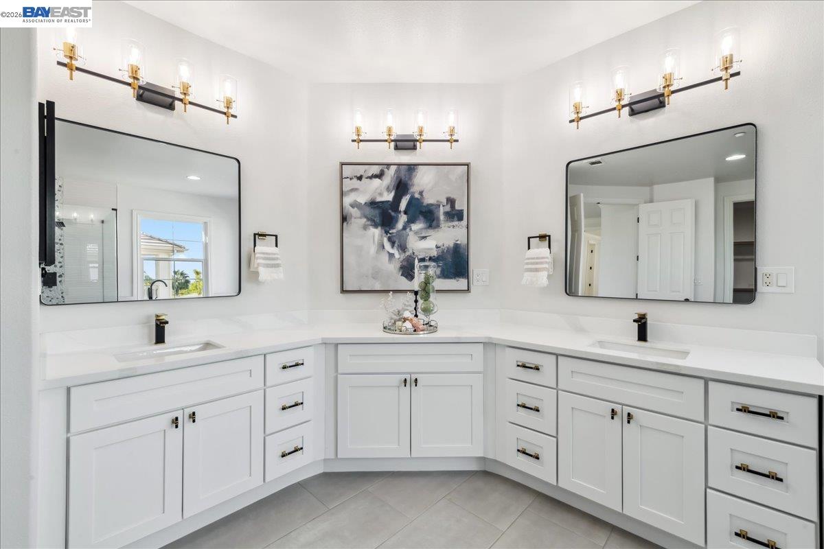 2890 Sable Oaks Way Dublin, CA 94568 - Photo 31 of 60 a spacious en suite bathroom with double sink and a mirror
