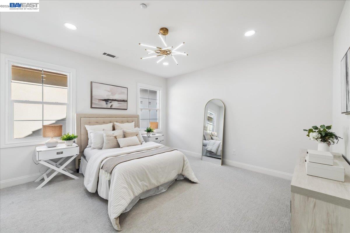 2890 Sable Oaks Way Dublin, CA 94568 - Photo 37 of 60 a bedroom with a bed and a chandelier