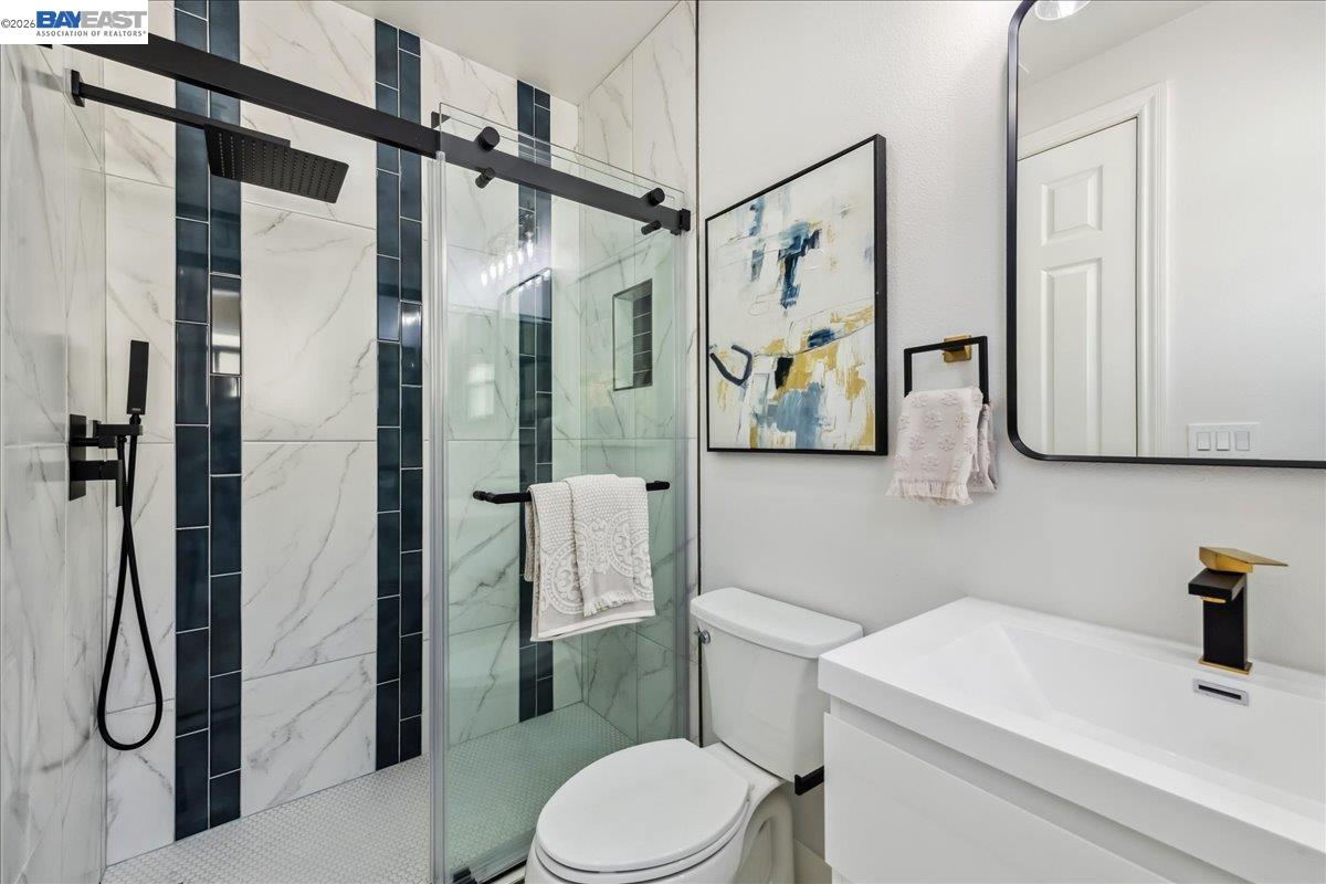 2890 Sable Oaks Way Dublin, CA 94568 - Photo 39 of 60 a bathroom with a toilet sink and shower