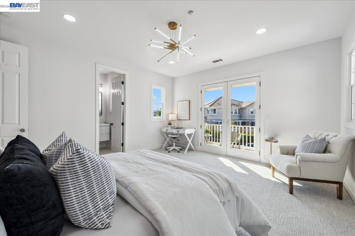 2890 Sable Oaks Way Dublin, CA 94568 - Photo 41 of 60 a bedroom with a bed a chandelier and a large window