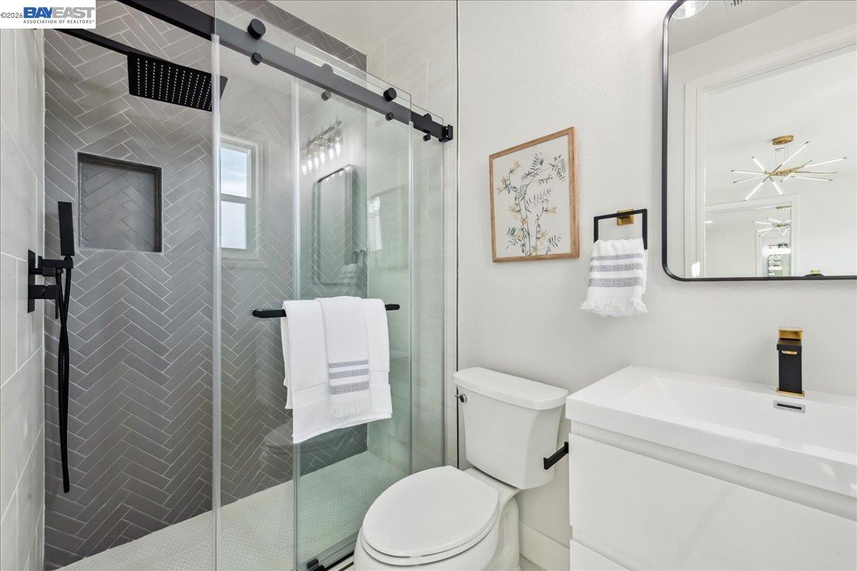 2890 Sable Oaks Way Dublin, CA 94568 - Photo 42 of 60 a white toilet sitting next to a bathroom sink