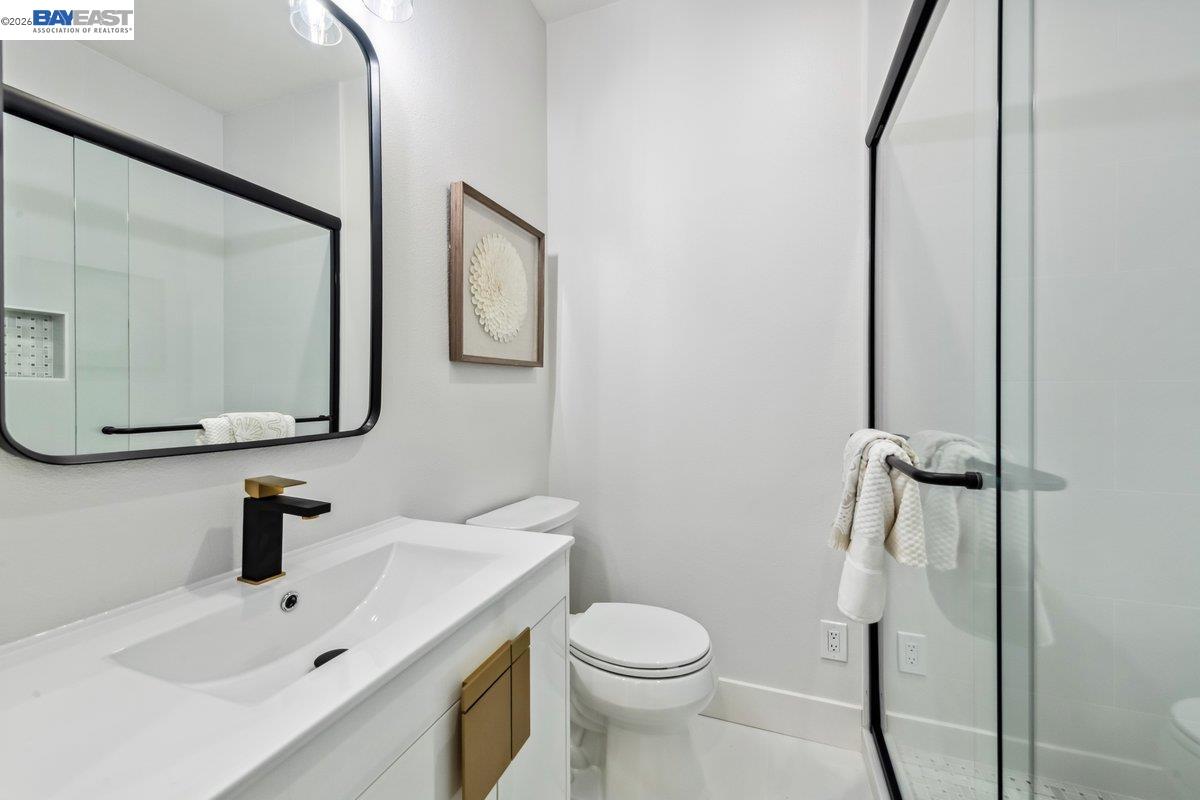 2890 Sable Oaks Way Dublin, CA 94568 - Photo 48 of 60 a bathroom with a sink mirror and toilet