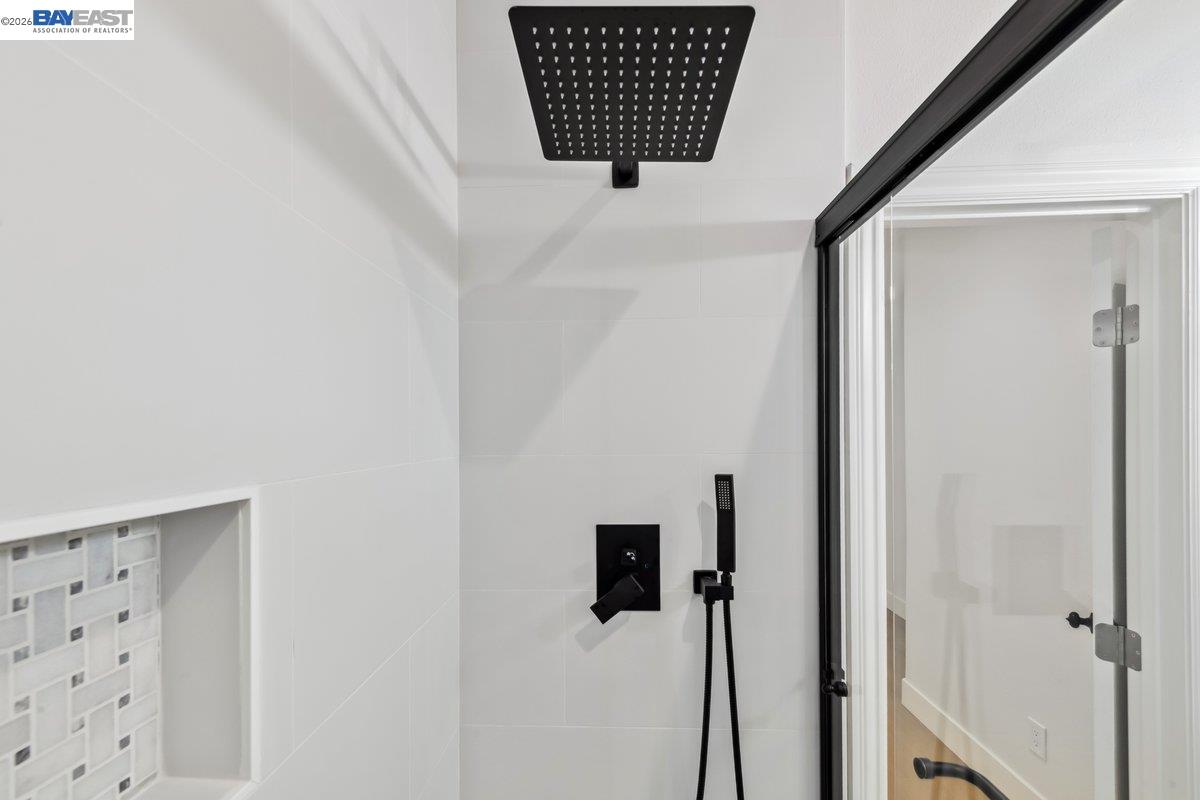 2890 Sable Oaks Way Dublin, CA 94568 - Photo 49 of 60 a bathroom with a shower and mirror