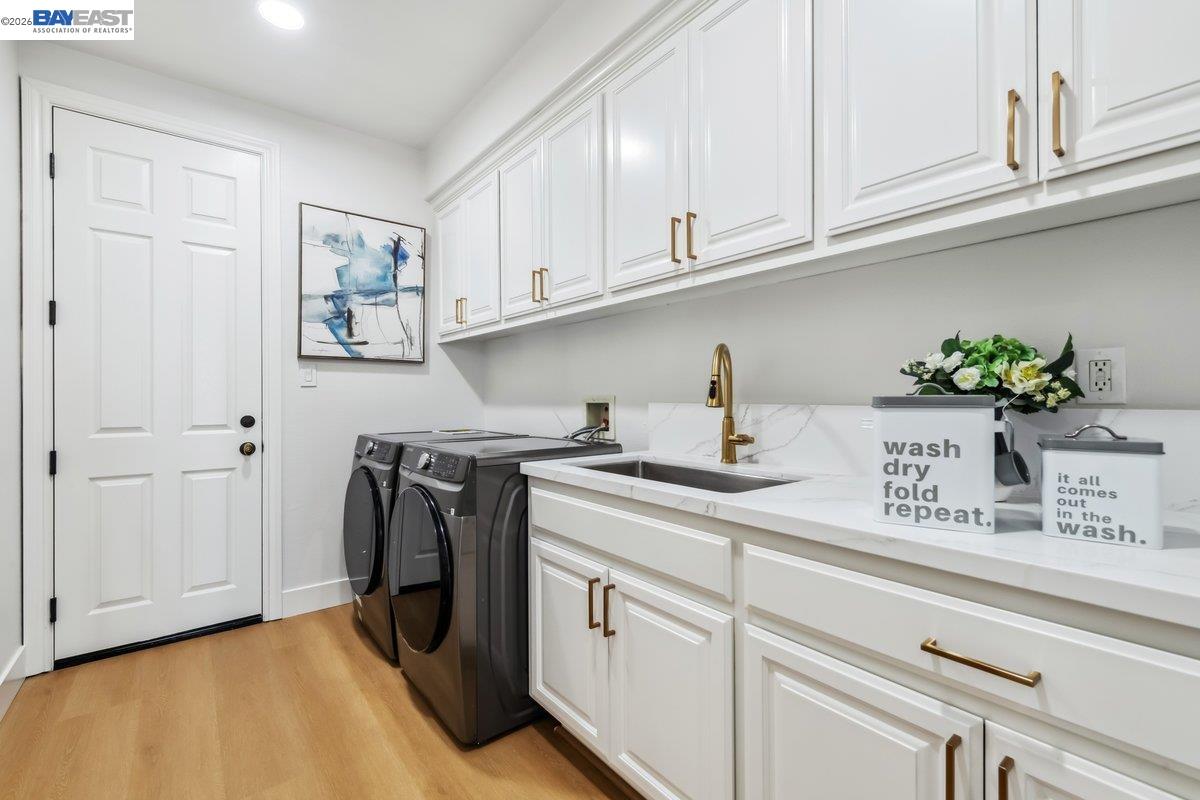 2890 Sable Oaks Way Dublin, CA 94568 - Photo 50 of 60 a kitchen with stainless steel appliances granite countertop a sink a stove and cabinets