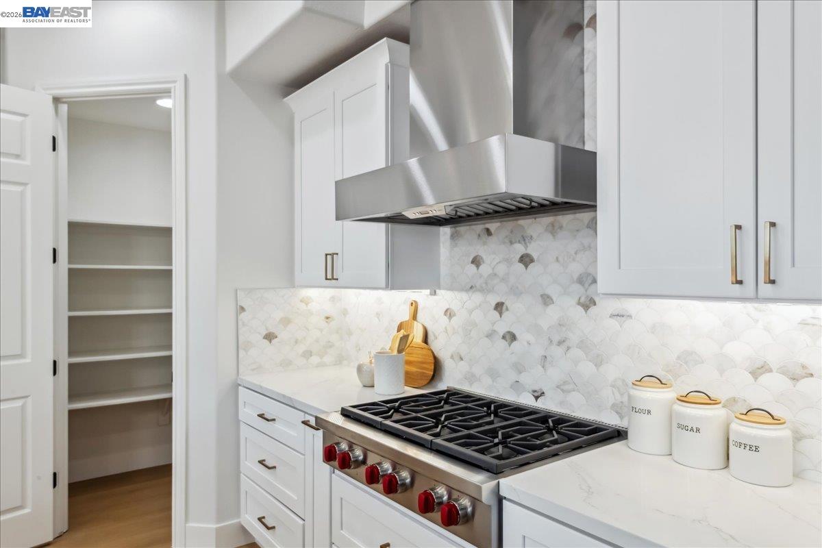 2890 Sable Oaks Way Dublin, CA 94568 - Photo 7 of 60 a kitchen with a stove and a white cabinet