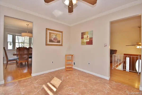 a view of livingroom with furniture and chandelier fan