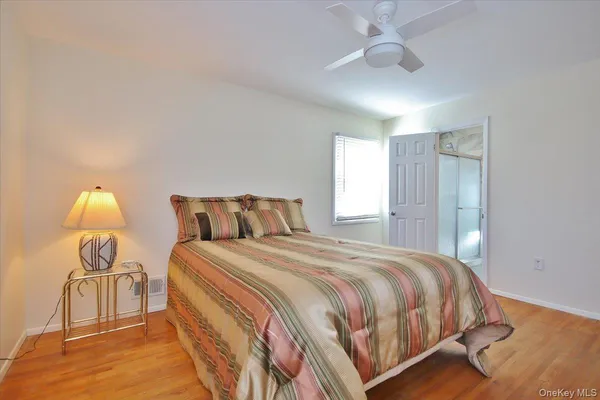 a bedroom with bed and a window