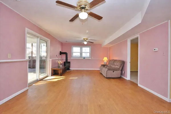 a spacious bedroom with a bed and a chandelier