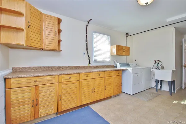 a bathroom with a sink vanity and mirror
