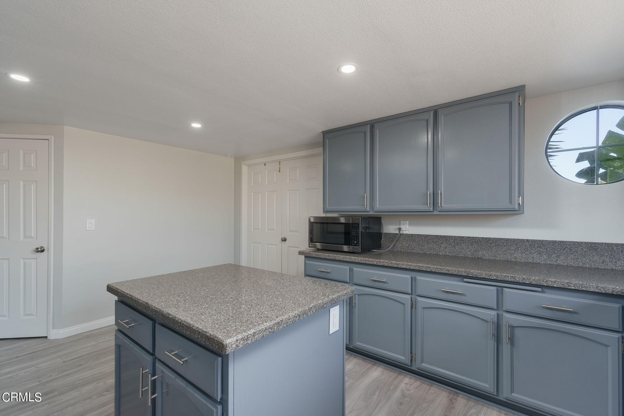 2940 Fanshell Walk Oxnard, CA 93035 - Photo 19 of 40 a kitchen with a sink and cabinets