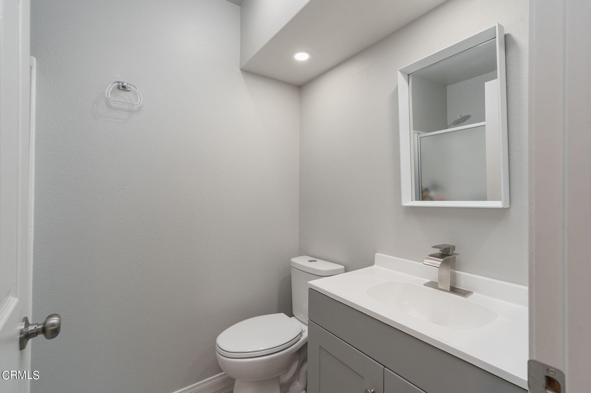 2940 Fanshell Walk Oxnard, CA 93035 - Photo 21 of 40 a bathroom with a sink toilet and vanity