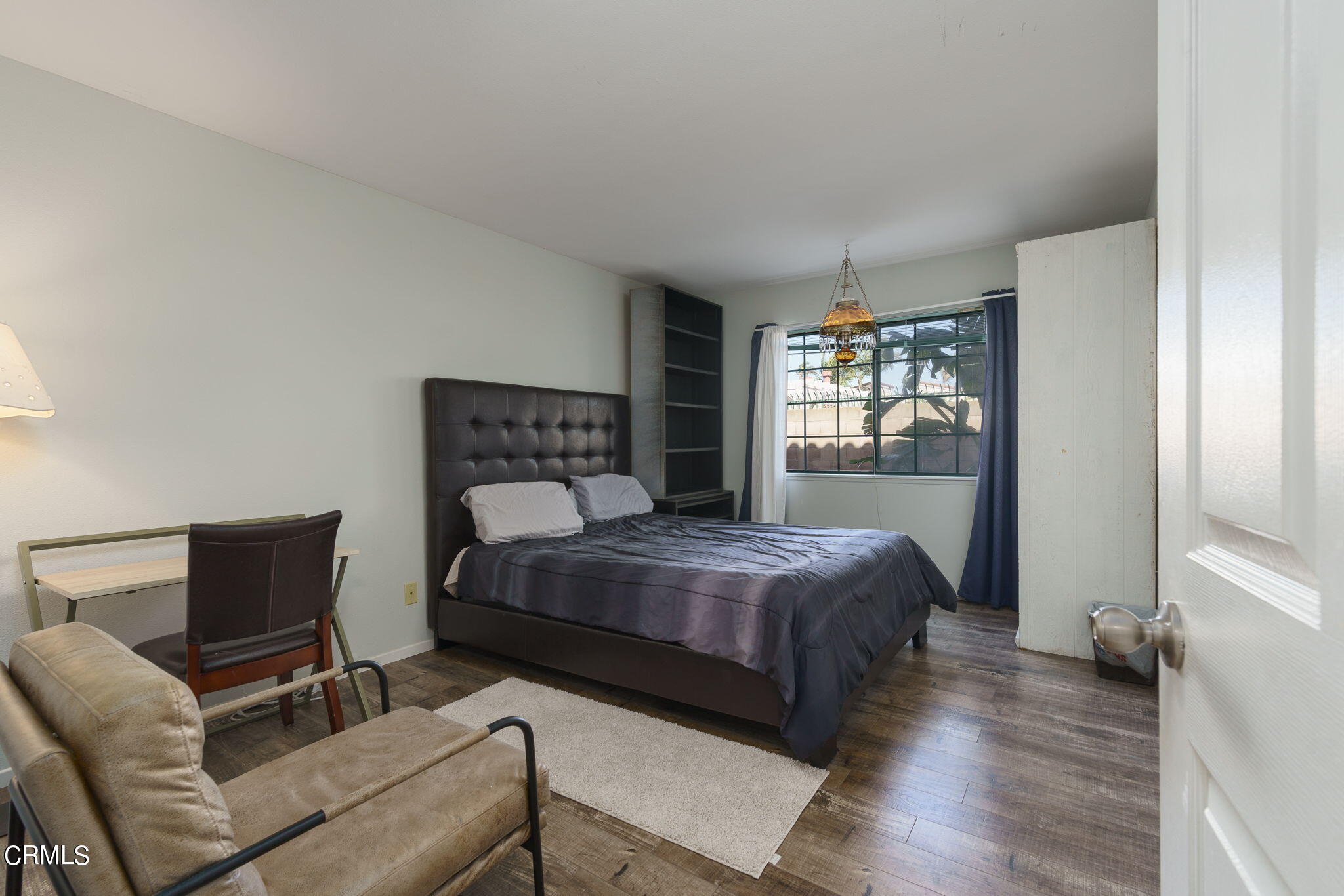 2940 Fanshell Walk Oxnard, CA 93035 - Photo 22 of 40 a bedroom with a bed and wooden floor