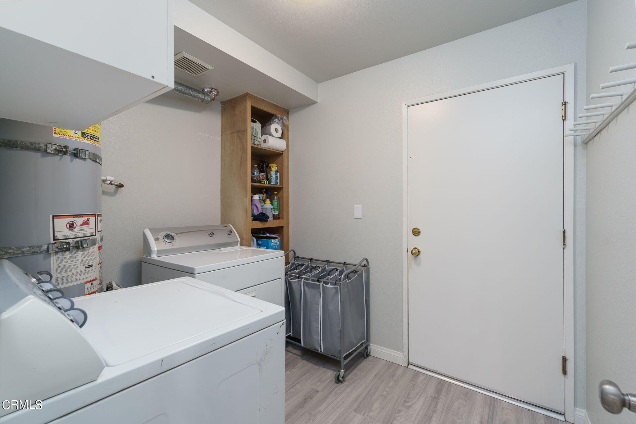 2940 Fanshell Walk Oxnard, CA 93035 - Photo 23 of 40 a view of storage and utility room with washer and dryer