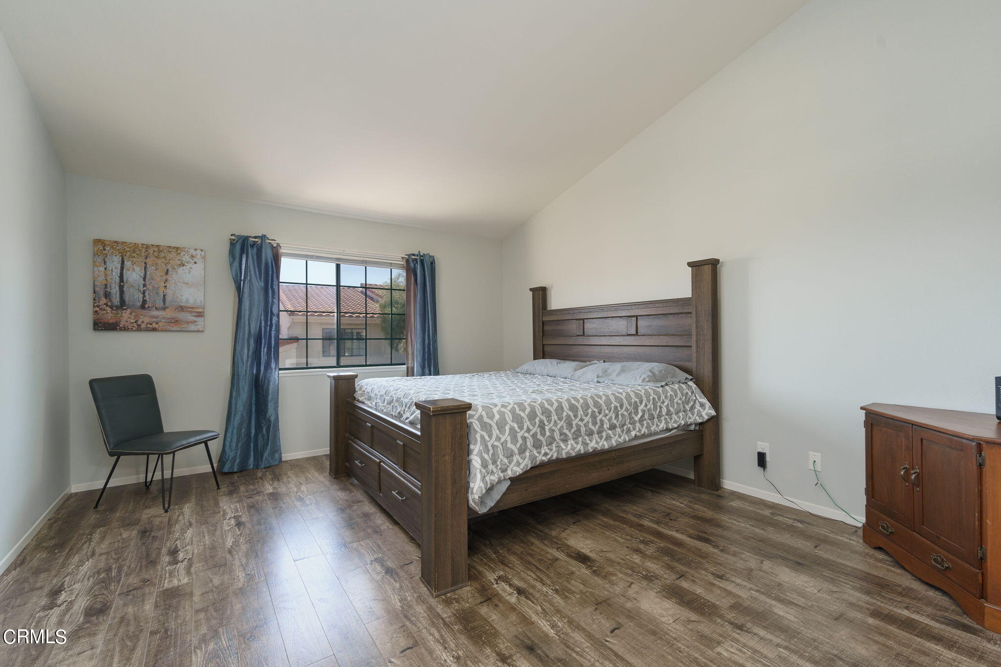 2940 Fanshell Walk Oxnard, CA 93035 - Photo 24 of 40 a bedroom with a bed chair and dresser