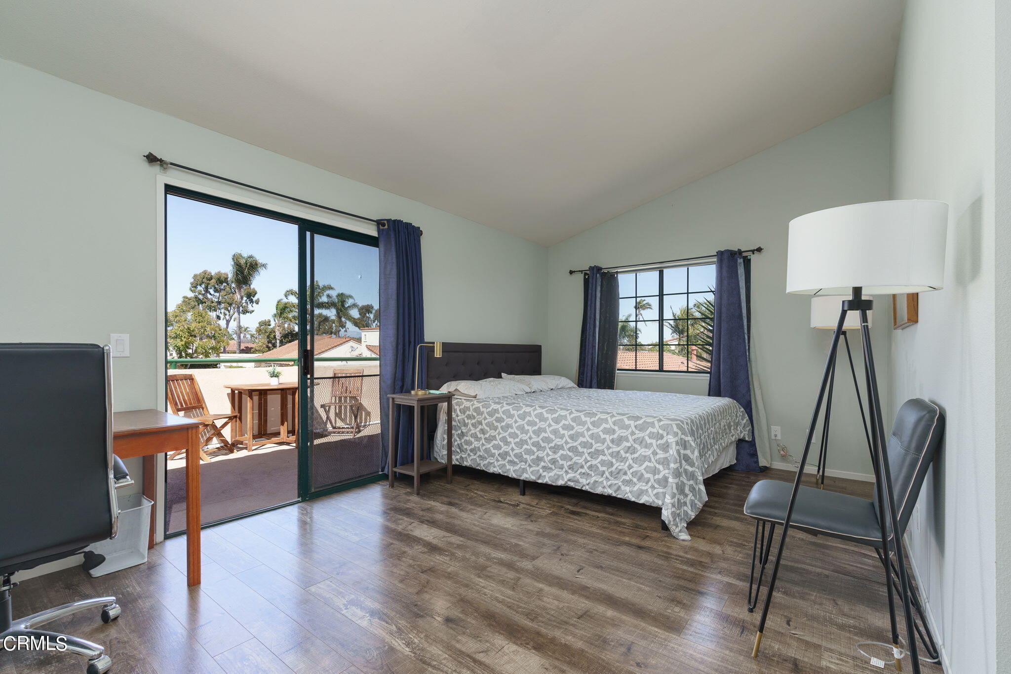 2940 Fanshell Walk Oxnard, CA 93035 - Photo 27 of 40 a bedroom with a bed and wooden floor