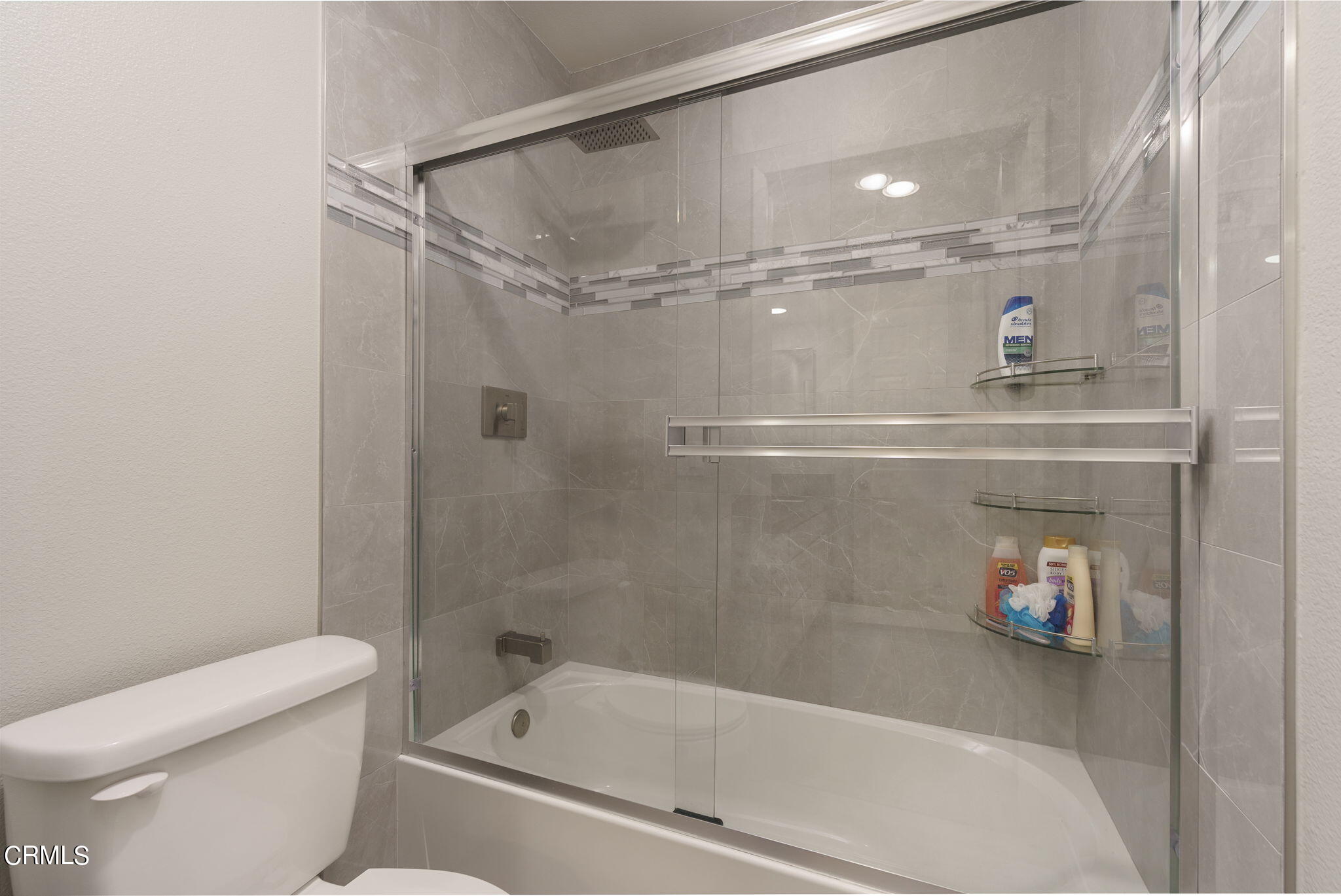 2940 Fanshell Walk Oxnard, CA 93035 - Photo 33 of 40 a bathroom with a shower a toilet and sink