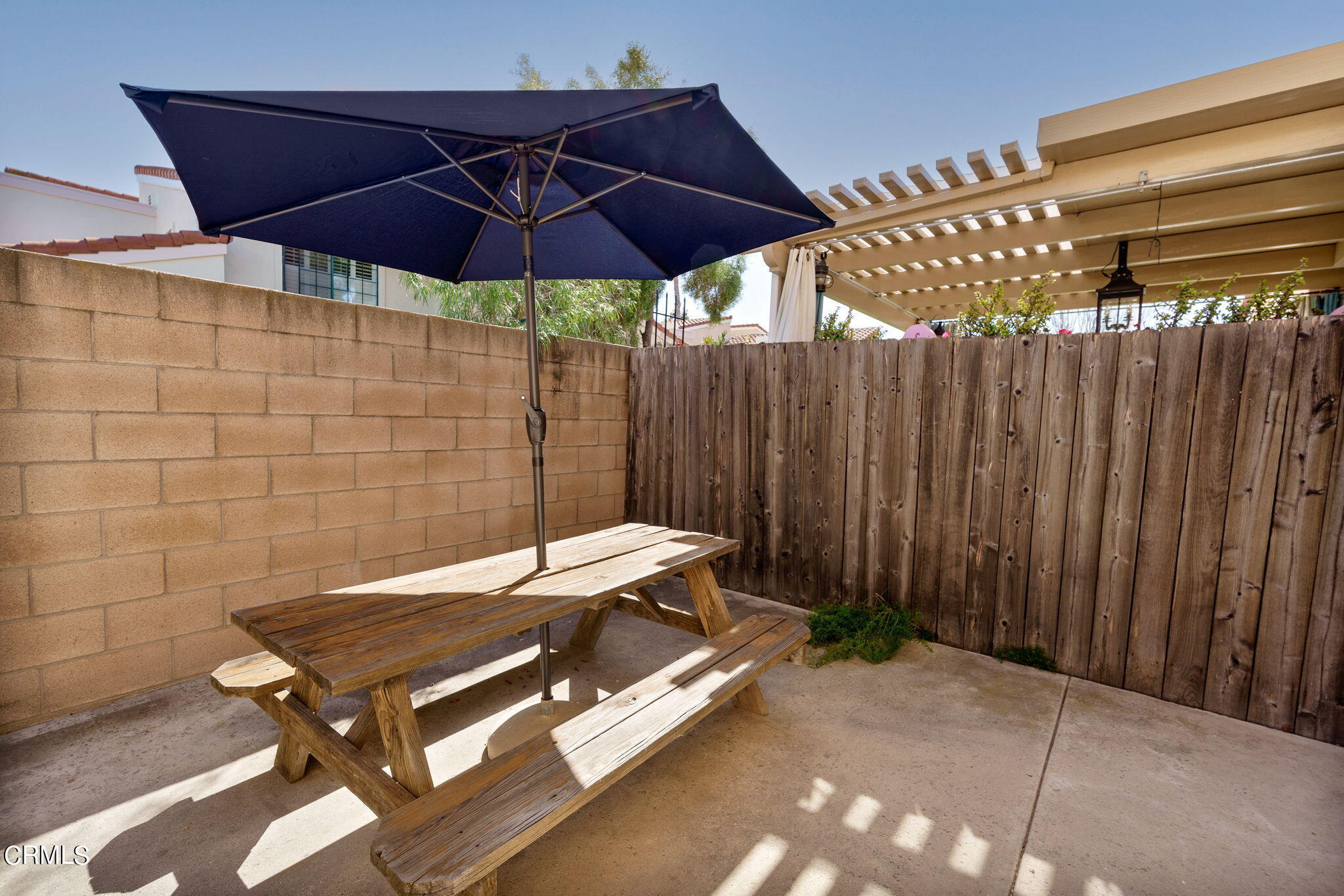 2940 Fanshell Walk Oxnard, CA 93035 - Photo 34 of 40 a blue bench sitting under a umbrella