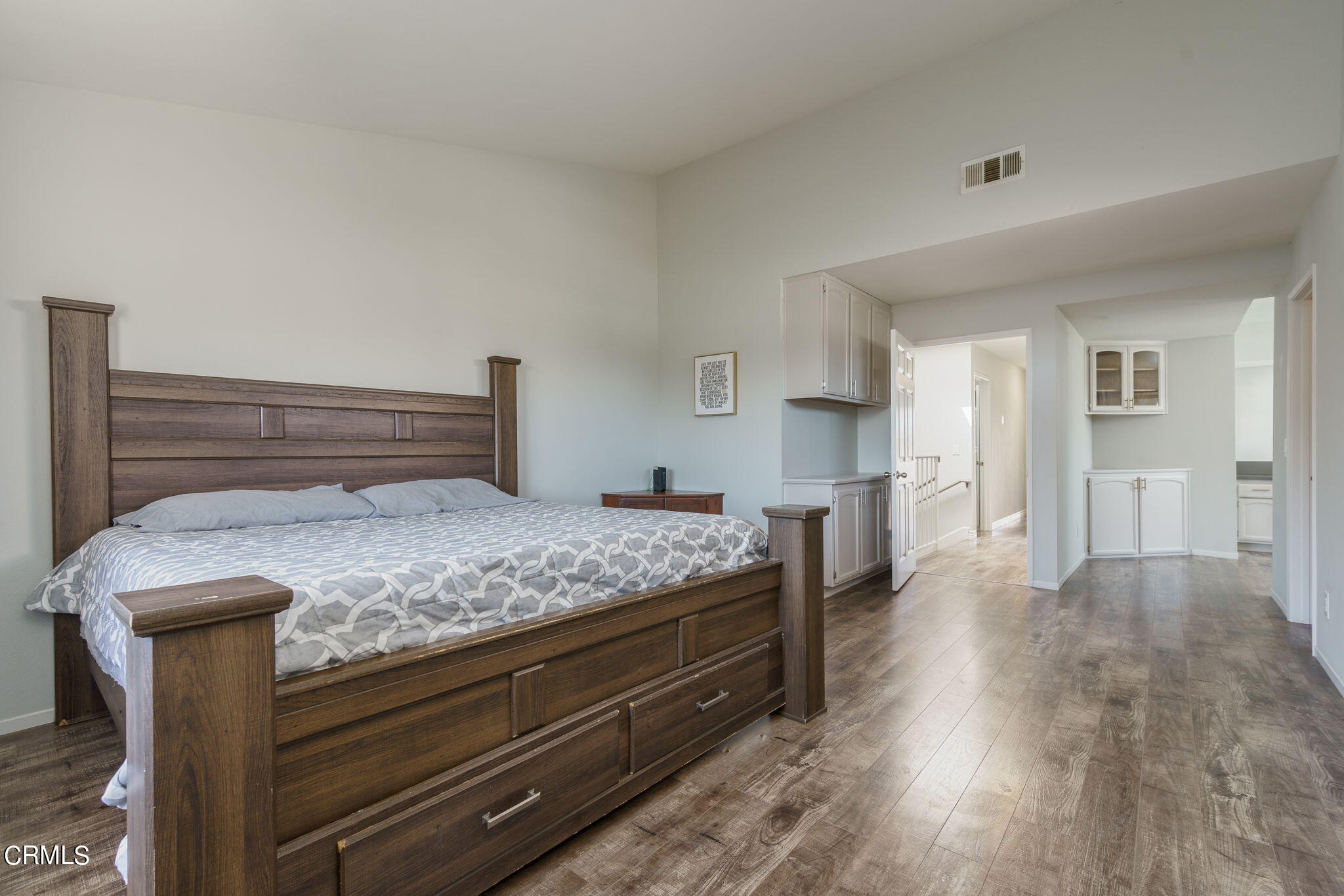 2940 Fanshell Walk Oxnard, CA 93035 - Photo 5 of 40 a bedroom with a bed and closet with wooden floor