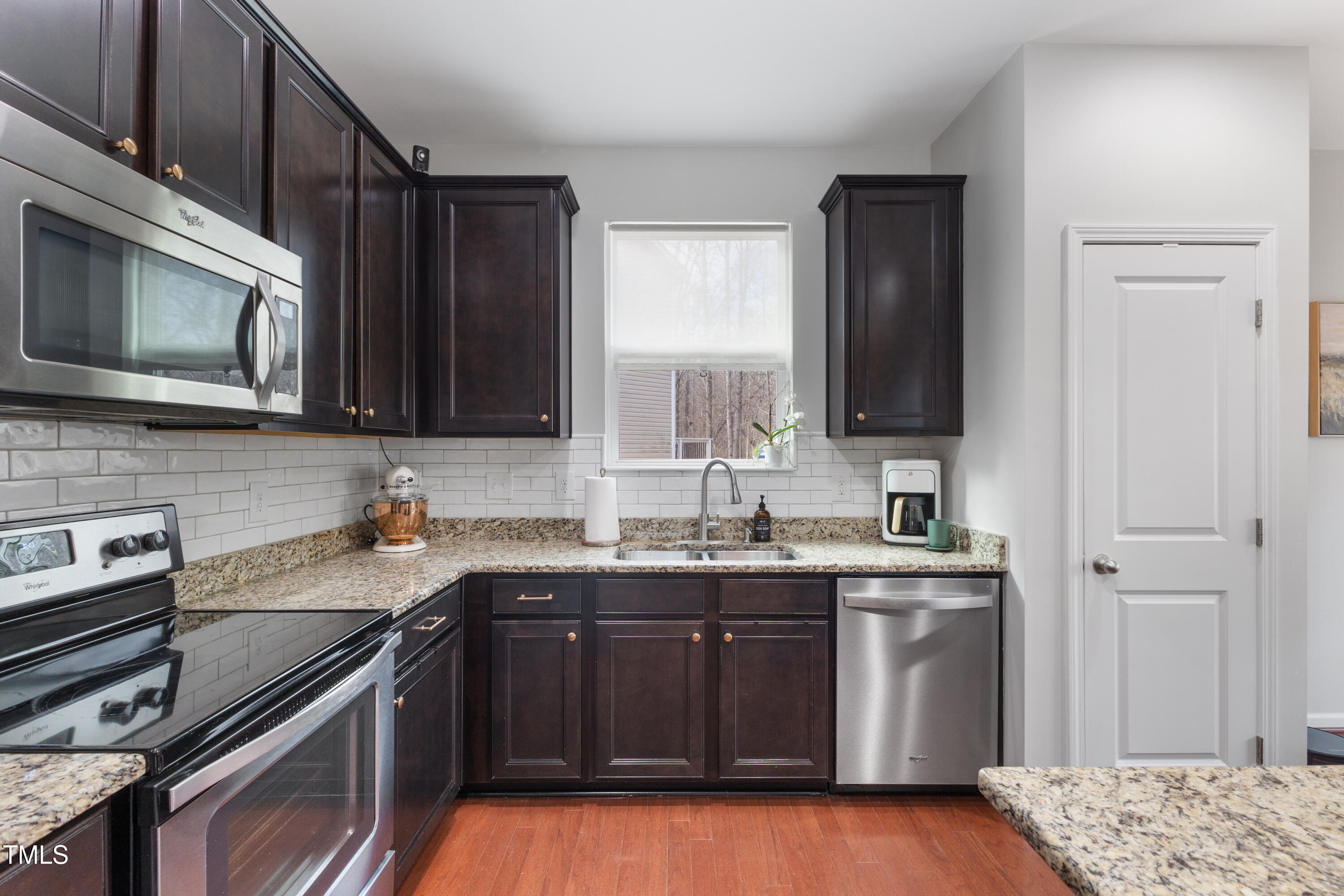 617 Hope Valley Road Knightdale, NC 27545 - Photo 12 of 42 a kitchen with a sink stove and microwave