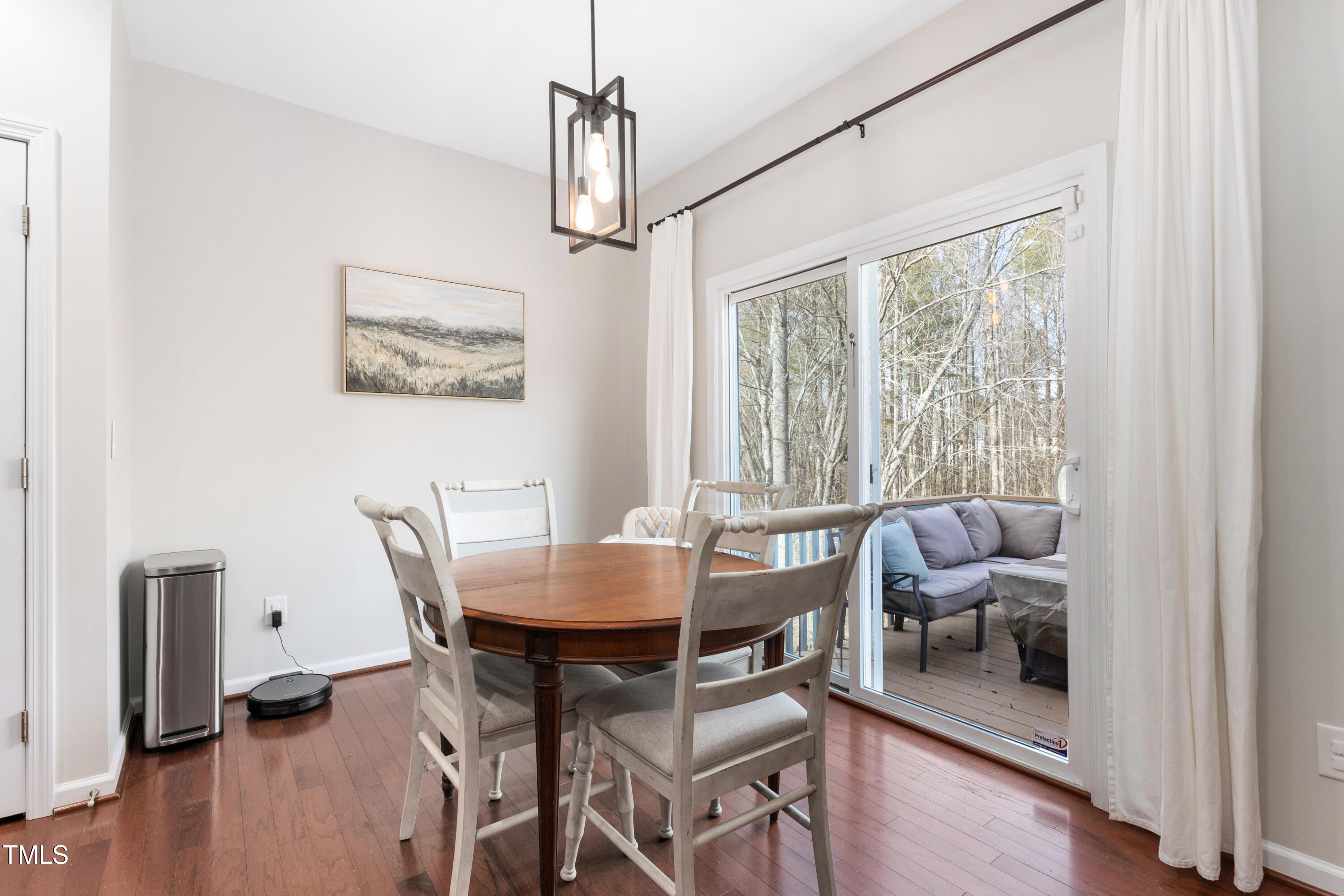 617 Hope Valley Road Knightdale, NC 27545 - Photo 13 of 42 a view of a dining room with furniture window and wooden floor